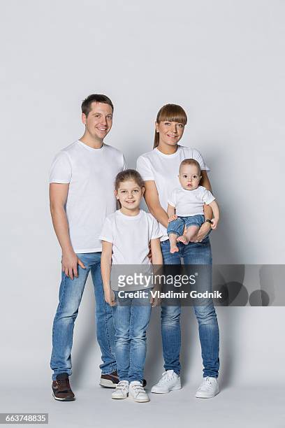 portrait of happy family against white background - family white stockfoto's en -beelden