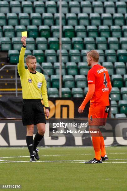 Ludvig Ohman of Athletic FC Eskilstuna shown a yellow card from head referee Glenn Nyberg during the Allsvenskan match between GIF sundsvall and...