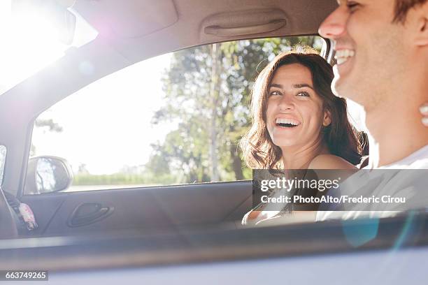 couple taking road trip - couple in car smiling stock pictures, royalty-free photos & images