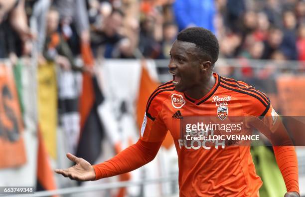 Lorient's French forward Benjamin Moukandjo celebrates after scoring during the French L1 football match between Lorient and Caen at Moustoir Stadium...