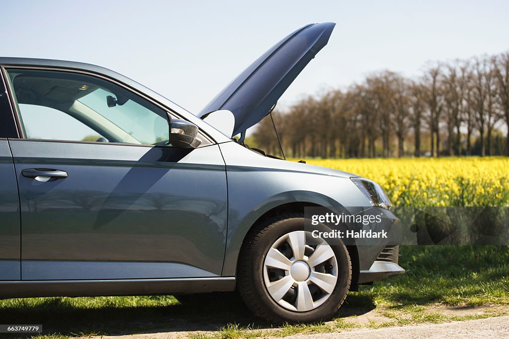 Cropped image of broken down car on roadside