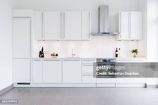 modern kitchen design with white cabinets - empty kitchen foto e immagini stock