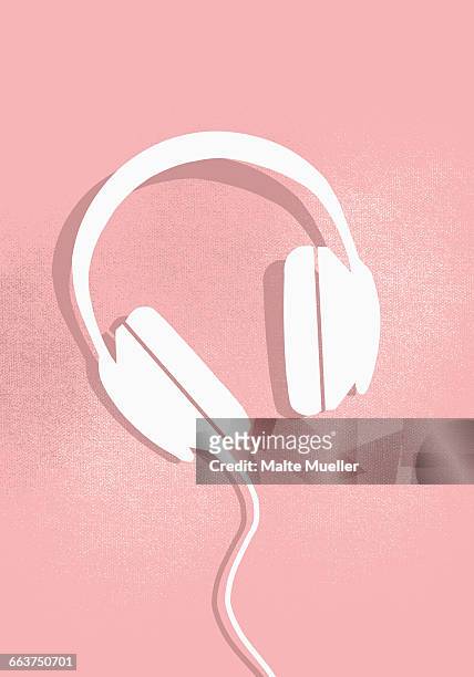 digital composite image of headphones on pink background - headphones stock illustrations