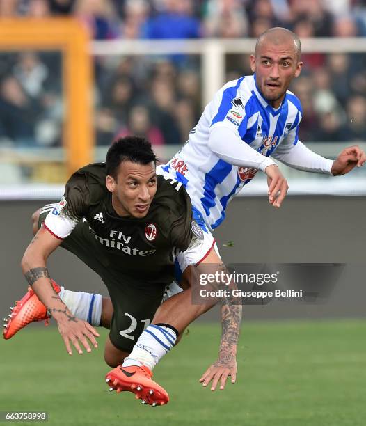 Leonel Vangioni of AC Milan and Ahmad Benali of Pescara Calcio in action during the Serie A match between Pescara Calcio and AC Milan at Adriatico...