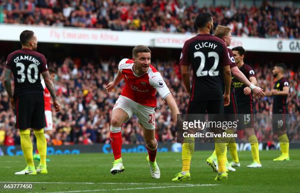 Shkodran Mustafi of Arsenal celebrates scoring his sides second goal during the Premier League match between Arsenal and Manchester City at Emirates...