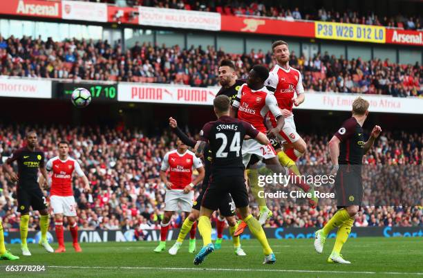 Shkodran Mustafi of Arsenal scores his sides second goal during the Premier League match between Arsenal and Manchester City at Emirates Stadium on...