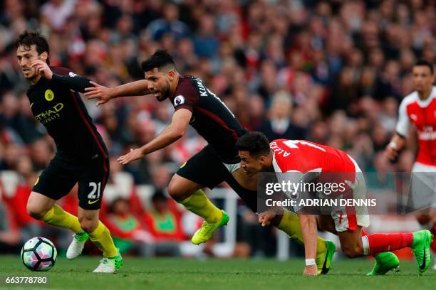 Arsenal's Chilean striker Alexis Sanchez vies with Manchester City's Argentinian striker Sergio Aguero and Manchester City's Spanish midfielder David...