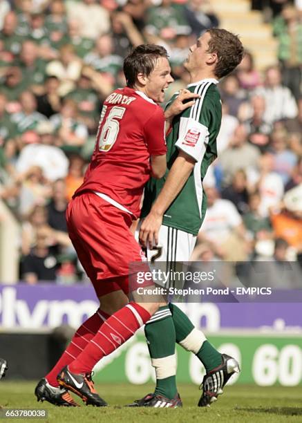 Nottingham Forest's Chris Gunter clashes with Plymouth Argyle's Shane Lowry as he celebrates scoring the opening goal