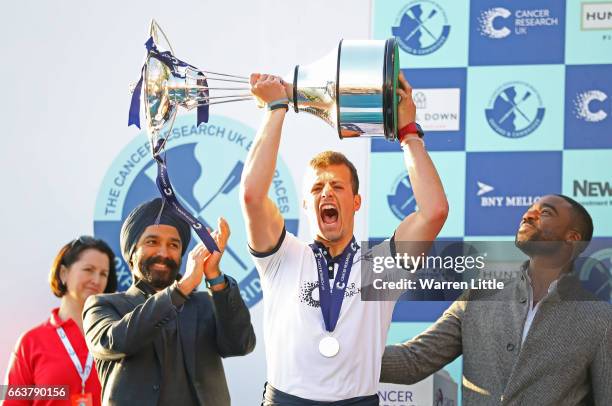 Michael DiSanto of Oxford celebrates with the trophy after winning The Cancer Research UK Boat Race on April 2, 2017 in London, England.