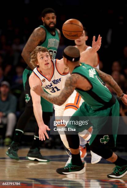 Ron Baker of the New York Knicks steals the ball from Isaiah Thomas of the Boston Celtics at Madison Square Garden on April 2, 2017 in New York City....