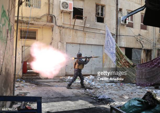An Iraqi Army member launches a rocket during the operation to retake Mosul from Daesh terrorists in Jadid neighborhood as the clashes between Iraqi...