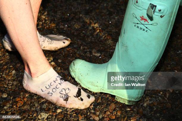 Detail view showing a Cambridge Wellington boot and a pair of 'Lucky Socks' after the women's Cancer Research UK Boat Race on April 2, 2017 in...