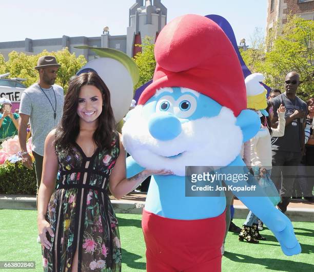 Demi Lovato poses with a Smurf at the Los Angeles Premiere "Smurfs: The Lost Village" at ArcLight Cinemas on April 1, 2017 in Culver City, California.