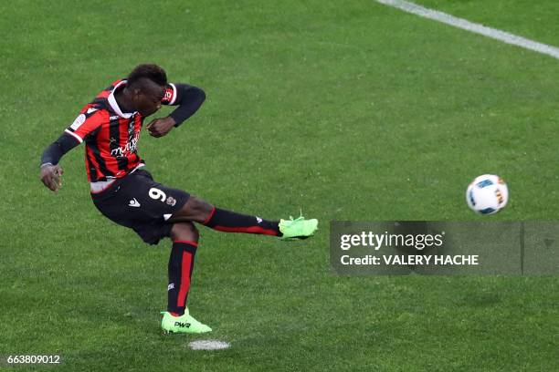 Nice's Italian forward Mario Balotelli shoots a penalty kick to score a goal during the French L1 football match Nice vs Bordeaux on April 2, 2017 at...