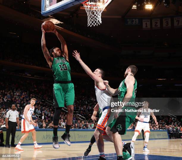 James Young of the Boston Celtics grabs the rebound during a game against the New York Knicks on April 2, 2017 at Madison Square Garden in New York...