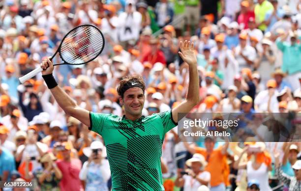 Roger Federer of Switzerland celebrates match point after defeating Rafael Nadal of Spain during the Men's Final and day 14 of the Miami Open at...