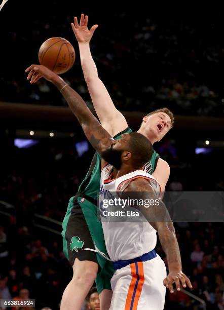 Jonas Jerebko of the Boston Celtics heads for the net as Kyle O'Quinn of the New York Knicks swats the ball at Madison Square Garden on April 2, 2017...