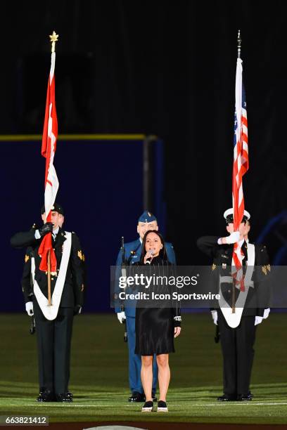 National anthem signer with military personnel behind during the Pittsburgh Pirates versus the Toronto Blue Jays Spring Training game on April 1 at...