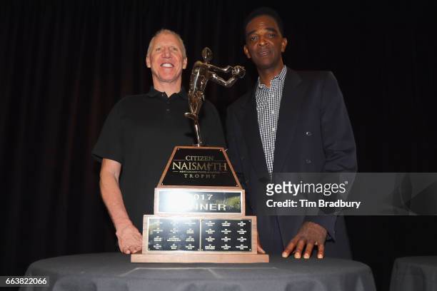 Bill Walton and Ralph Sampson pose with the 2017 Citizen Naismith Trophy during the 2017 Naismith Awards Brunch at the Grayhawk Golf Club on April 2,...