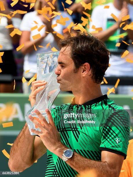 Roger Federer of Switzerland with the winners trophy after defeating Rafael Nadal of Spain on day 14 of the Miami Open at Crandon Park Tennis Center...
