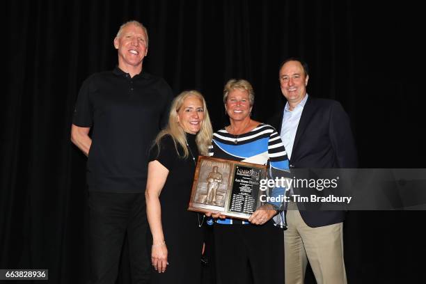 Ann Meyers Drysdale is presented with the 2017 Naismith Outstanding Contributor to Womens Basketball Award as Bill Walton looks on during the 2017...