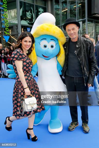 German actor Heiner Lauterbach and his wife Viktoria Lauterbach with smurf 'Schlumpfine' during the 'Die Schluempfe - Das verlorene Dorf' premiere at...