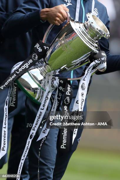 Swansea City players celebrating wining the Premier League 2 League with the PL2 trophy at half time during the Premier League match between Swansea...