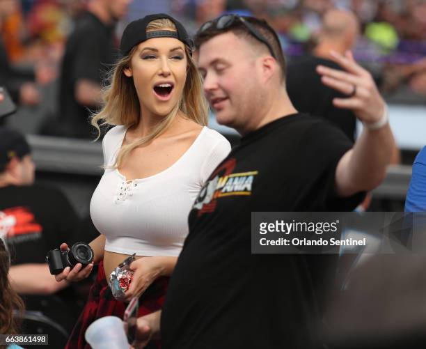 Fans take pictures during WrestleMania 33 on Sunday, April 2, 2017 at Camping World Stadium in Orlando, Fla.