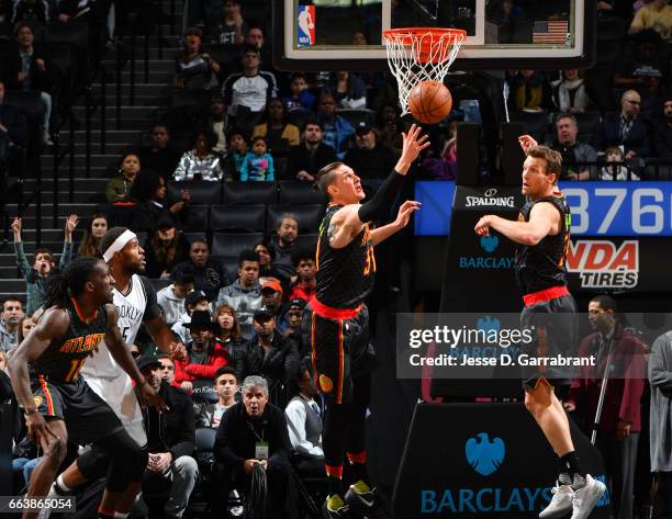 Ryan Kelly of the Atlanta Hawks grabs the rebound against the Brooklyn Nets on April 2, 2017 at Barclays Center in Brooklyn, New York. NOTE TO USER:...