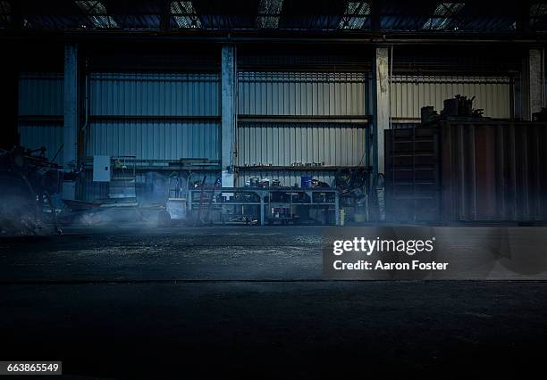 moody work shop - empty garage stock pictures, royalty-free photos & images