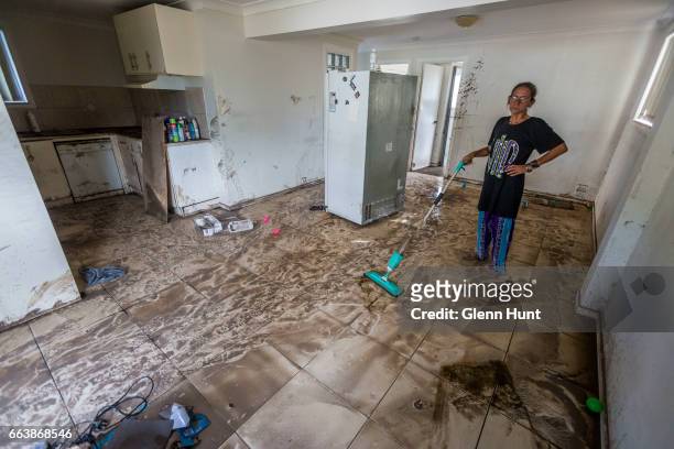 Home renter Charne Harris poses for a photograph at her flood damaged home on April 3, 2017 in Beenleigh, Australia. Heavy rain caused flash flooding...