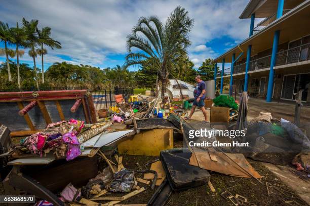 Volunteer Alan Dear helps clean up a property at Eagleby that was damaged by flood water on April 3, 2017 in Eagleby, Australia. Heavy rain caused...