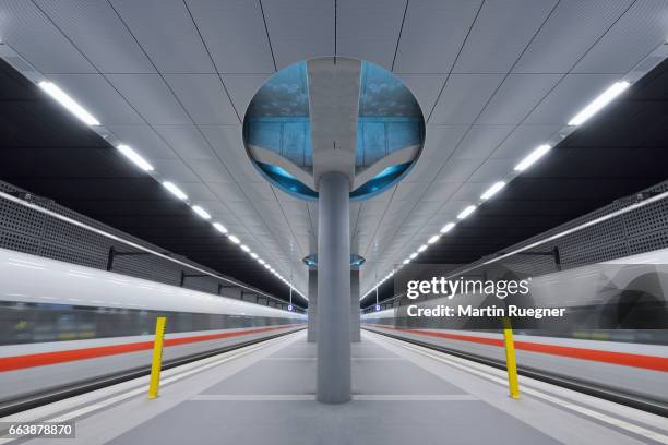 berlin central station (haubtbahnhof) platform, moving train blurred motion digital composite. - berlin hauptbahnhof stock-fotos und bilder