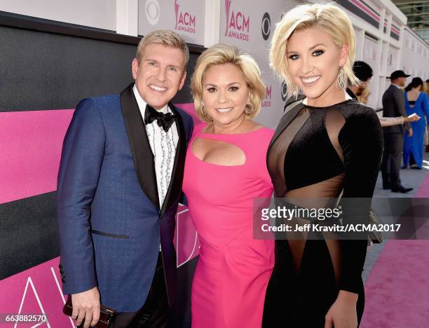 Personalities Todd Chrisley and Julie Chrisley, and Savannah Chrisley attend the 52nd Academy Of Country Music Awards at Toshiba Plaza on April 2,...