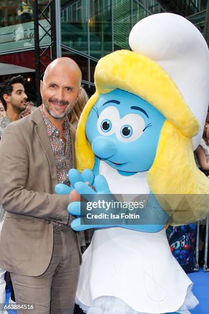 German actor Christoph Maria Herbst with smurf 'Schlumpfine' during the 'Die Schluempfe - Das verlorene Dorf' premiere at Sony Centre on April 2,...