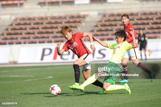 Yuika Sugasawa of Urawa Red Diamonds Ladies and Shouko Chino Shoko of JEF United Chiba Ladies compete for the ball during the Nadeshiko League match...