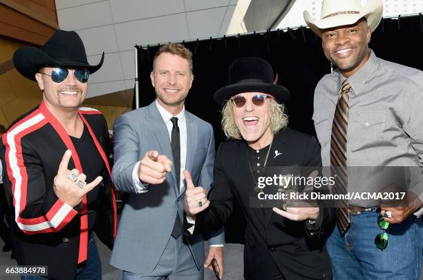 Recording artists Big Kenny and John Rich of music group Big & Rich, Dierks Bentley (2nd from and Cowboy Troy attend the 52nd Academy Of Country...