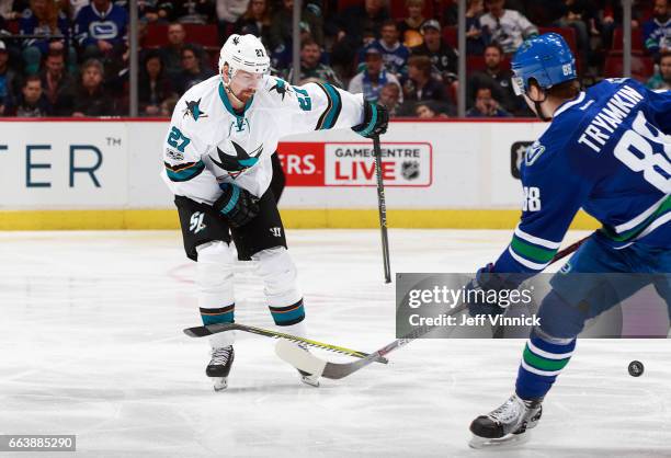 April 2: Nikita Tryamkin of the Vancouver Canucks looks on as Joonas Donskoi of the San Jose Sharks breaks his stick with a slap-shot during their...