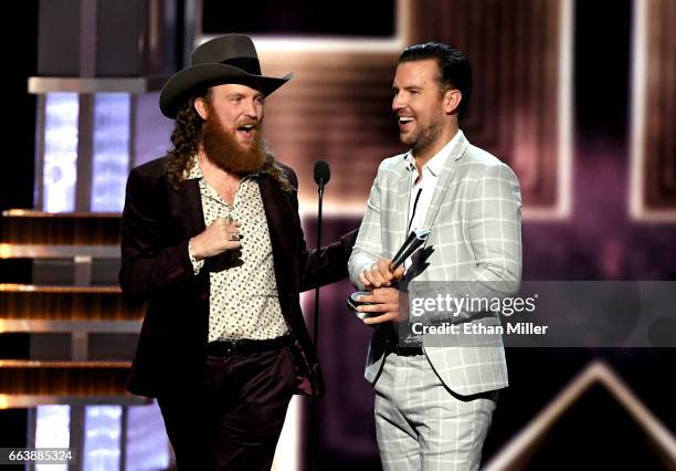 Recording artists John Osborne and T.J. Osborne of music group Brothers Osborne accept the Vocal Duo of the Year award onstage during the 52nd...