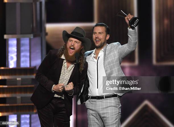 Recording artists John Osborne and T.J. Osborne of music group Brothers Osborne accept the Vocal Duo of the Year award onstage during the 52nd...