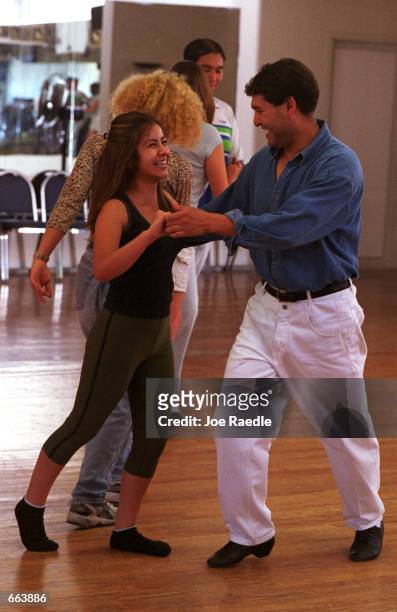 Dana Hayes and Ubaldo Armenta learn the steps to ballroom dancing June 3, 2000 in El Paso, Texas. The classes, which are sponsored by the United...