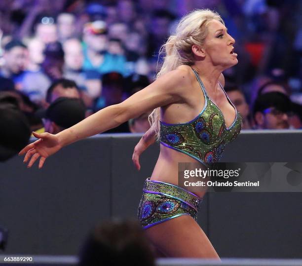 Charlotte Flair runs during WrestleMania 33 on Sunday, April 2, 2017 at Camping World Stadium in Orlando, Fla.