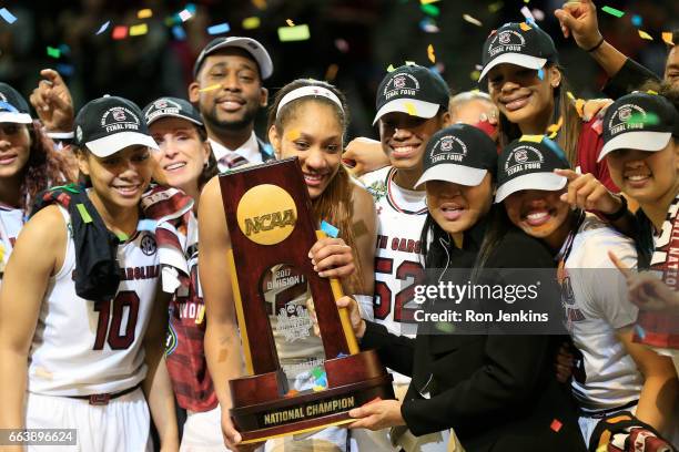 Ja Wilson and head coach Dawn Staley of the South Carolina Gamecocks hold the NCAA trophy and celebrates with their team after winning the...