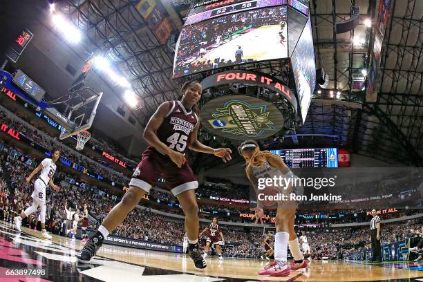 Chinwe Okorie of the Mississippi State Lady Bulldogs battles for the ball with A'ja Wilson of the South Carolina Gamecocks during the second half of...