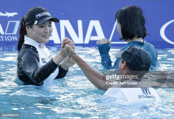 So Yeon Ryu of the Republic of Korea celebrates with her caddie Tom Watson after defeating Lexi Thompson in a playoff during the final round of the...