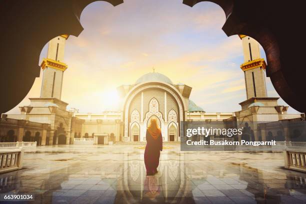 malaysia mosque with muslim pray in malaysia, female malaysian muslim pray at mosque, kuala lumpur malaysia - crystal mosque stock pictures, royalty-free photos & images