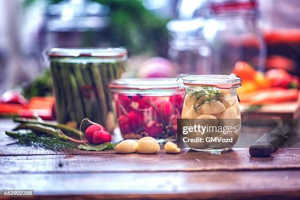 preserving organic vegetables in jars - pickle relish stock pictures, royalty-free photos & images