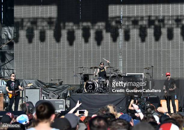 Guitarist Mark Hoppus, drummer Travis Barker and singer Matt Skiba of blink-182 perform at the Capital One JamFest during the NCAA March Madness...