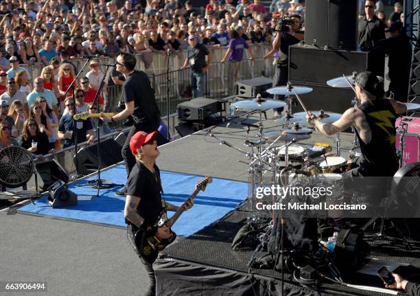 Guitarist Mark Hoppus, drummer Travis Barker and guitarist Matt Skiba of blink-182 perform at the Capital One JamFest during the NCAA March Madness...