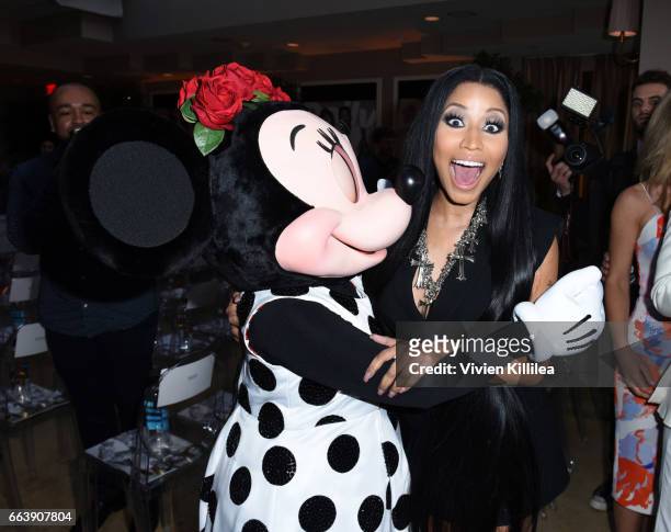 Minnie Mouse and Nicki Minaj attend Fashion LA Awards at the Sunset Tower Hotel on April 2, 2017 in West Hollywood, California. Minnie is wearing a...